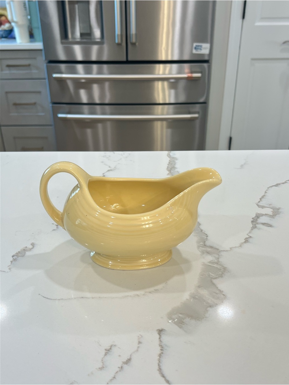 Vintage Fiesta Ware light yellow “sunflower” gravy boat EUC